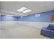 Spacious basement with blue and white walls, neutral carpet, and recessed lighting at 5081 S Emporia St, Greenwood Village, CO 80111