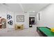 Finished basement with hexagonal shelving and plenty of room for activities at 5081 S Emporia St, Greenwood Village, CO 80111
