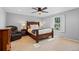 Bedroom with a ceiling fan, hardwood furniture, and a bright sunny window at 5081 S Emporia St, Greenwood Village, CO 80111