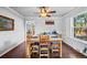 Bright dining room features hardwood floors, a ceiling fan, and is adjacent to a living space at 5081 S Emporia St, Greenwood Village, CO 80111