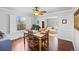 Dining room with hardwood floors, natural light and is adjacent to a living area at 5081 S Emporia St, Greenwood Village, CO 80111