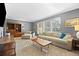 Comfortable living room with plush furniture, large windows with shutters, and neutral color palette at 5081 S Emporia St, Greenwood Village, CO 80111