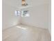 Bright and airy bedroom with hardwood floors and two windows providing natural light at 6585 E Nevada Pl, Denver, CO 80224