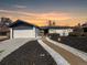 Charming home with an attached garage and beautifully landscaped front yard, perfect for curb appeal at 6585 E Nevada Pl, Denver, CO 80224