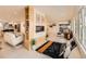 Stylish living area with open layout, built-in shelving, and a modern fireplace, perfect for relaxing and entertaining at 6585 E Nevada Pl, Denver, CO 80224