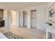 Bright main bedroom with hardwood floors, a walk-in closet, and an ensuite bathroom at 6585 E Nevada Pl, Denver, CO 80224