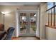 French doors leading to the outdoor patio and backyard area, with natural light and views at 12028 W Aqueduct Dr, Littleton, CO 80127