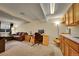 Finished basement area with a cozy seating area, workspace, and wet bar for entertainment at 12028 W Aqueduct Dr, Littleton, CO 80127