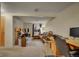 Spacious basement with seating, workspace, and natural light creating a versatile living area at 12028 W Aqueduct Dr, Littleton, CO 80127