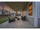 Covered patio with comfortable seating, perfect for relaxing outdoors, and enjoying the evening at 12028 W Aqueduct Dr, Littleton, CO 80127