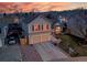 Charming two-story home with a two-car garage, landscaped front yard, and inviting curb appeal at 12028 W Aqueduct Dr, Littleton, CO 80127