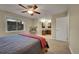 Spacious primary bedroom with neutral walls, carpet flooring, and attached bathroom area with dual sinks at 12028 W Aqueduct Dr, Littleton, CO 80127