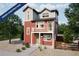 New construction two-story home featuring a balcony, gravel landscaping, and a charming exterior design at 13563 E 103Rd Pl, Commerce City, CO 80022