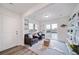 Bright, airy living room with large sliding glass doors and stylish decor at 13563 E 103Rd Pl, Commerce City, CO 80022
