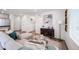Comfortable open plan living space with modern furniture and stylish accents at 13563 E 103Rd Pl, Commerce City, CO 80022