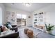 Well-lit room with comfy seating and views from sliding glass doors at 13563 E 103Rd Pl, Commerce City, CO 80022