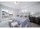 Comfortable main bedroom with a balcony view, offering a relaxing retreat at 13563 E 103Rd Pl, Commerce City, CO 80022