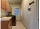 Convenient laundry room with washer, dryer, and built-in cabinets at 627 N Pines Trl, Parker, CO 80138