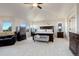 Main bedroom suite with sitting area and large windows at 627 N Pines Trl, Parker, CO 80138