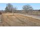 Backyard with grass, trees, and a view of a golf course at 2833 W 119Th Ave # 15-102, Denver, CO 80234