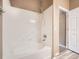 Bathroom features a tub with white tile and chrome fixtures at 2833 W 119Th Ave # 15-102, Denver, CO 80234