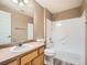 Bathroom with laminate floors, a tub, and a wood vanity at 2833 W 119Th Ave # 15-102, Denver, CO 80234