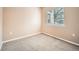 Small bedroom with window and neutral colored walls at 2833 W 119Th Ave # 15-102, Denver, CO 80234