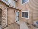 Townhome entrance with security gate and walkway at 2833 W 119Th Ave # 15-102, Denver, CO 80234