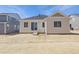 A view of the backyard with sliding glass doors at 4066 N Irvington St, Aurora, CO 80019