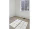 Bedroom with neutral carpet, white walls, and a large window providing natural light at 4066 N Irvington St, Aurora, CO 80019