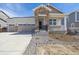 Charming home with stone accents, covered porch, manicured landscaping and a two car garage at 4066 N Irvington St, Aurora, CO 80019