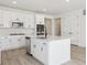 An island with stainless dishwasher and sink in the kitchen at 4066 N Irvington St, Aurora, CO 80019