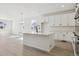 A kitchen with white cabinets and an island at 4066 N Irvington St, Aurora, CO 80019