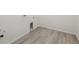 Laundry room with wood-style floors and hookups for washer and dryer at 4066 N Irvington St, Aurora, CO 80019