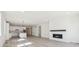 Spacious living room and kitchen area with an electric fireplace at 4066 N Irvington St, Aurora, CO 80019