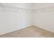 Walk-in closet featuring neutral carpet and wire shelving for ample storage at 4066 N Irvington St, Aurora, CO 80019