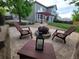 Outdoor seating area with a fire pit and chairs perfect for outdoor entertainment at 518 Zircon Way, Superior, CO 80027