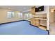 Finished basement with kitchenette and large, tiled area at 518 Zircon Way, Superior, CO 80027