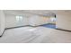 Finished basement with windows, carpet, and a large rec area at 518 Zircon Way, Superior, CO 80027