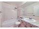 This bathroom features a shower/tub combo, granite countertop and neutral ceramic tile at 518 Zircon Way, Superior, CO 80027