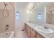 This bathroom features granite countertops, double sinks, and a shower/tub combo at 518 Zircon Way, Superior, CO 80027