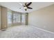 Bedroom with ceiling fan and bright carpeted area at 518 Zircon Way, Superior, CO 80027