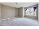 This bedroom features neutral paint, carpet, a ceiling fan, and a double window at 518 Zircon Way, Superior, CO 80027