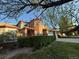 Charming brick home with mature landscaping and a sprawling lawn on a sunny day at 518 Zircon Way, Superior, CO 80027