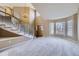 Elegant foyer with a curved staircase, neutral tones, and a grand two-story entryway at 518 Zircon Way, Superior, CO 80027