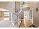 Spacious foyer showcasing a curved staircase and hardwood flooring, creating a welcoming atmosphere at 518 Zircon Way, Superior, CO 80027