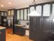 Spacious kitchen featuring dark cabinets, stainless steel appliances, and hardwood floors at 518 Zircon Way, Superior, CO 80027