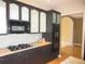 Well-equipped kitchen with dark cabinetry, granite countertops, and modern appliances at 518 Zircon Way, Superior, CO 80027