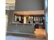 Open kitchen with modern dark cabinets, stainless steel appliances, a breakfast bar and hardwood floors at 518 Zircon Way, Superior, CO 80027