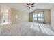 Expansive main bedroom with vaulted ceilings, neutral carpet, and an en-suite bathroom at 518 Zircon Way, Superior, CO 80027